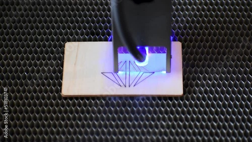 Diode laser engraving and cutting a polygonal heart model on wood