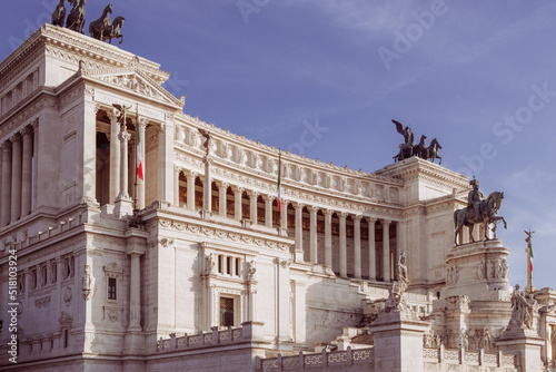 Spectacular view of Monument of Vittorio Emanuele II in Rome with blue sky in background.