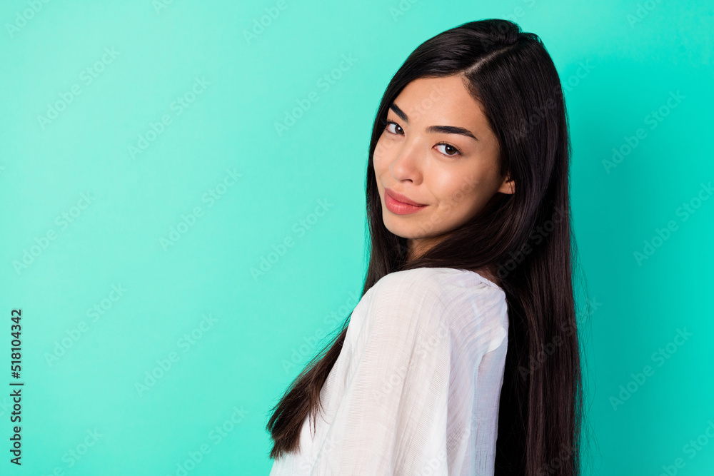 Profile portrait of lovely cute young person long black hairdo empty space isolated on bright teal color background Profile portrait of lovely cute young person long black hairdo empty space isolated on bright teal color background