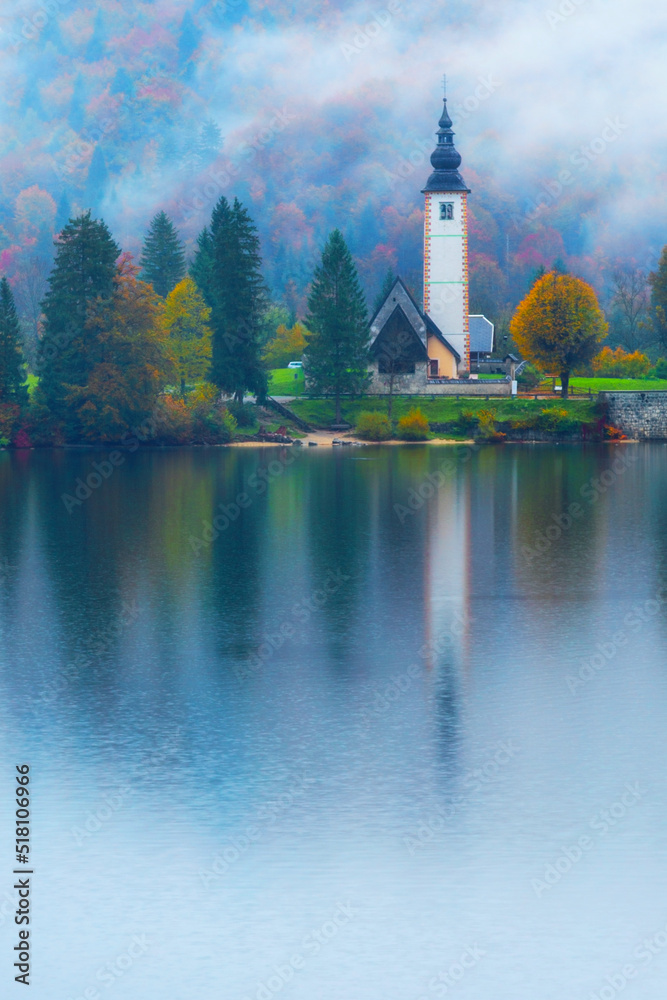 famous tourist destination the Saint John the Baptist church on the shore of gorgeous Bohinj lake in Slovenia