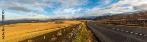 Panoramic road of the garden route that runs along the fynbos peninsula along the entire south african coast from Port Elizabeth to Cape Town with idyllic landscapes in the background.