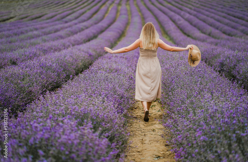 Girl in a hat in lavender in Provence