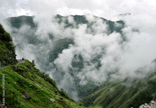 The mist covered terrain turns green during monsoon look mesmerizing at Tsomgo Lake area situated at 12,600 ft altitude under Pangolakha Wildlife Sanctuary in Sikkim.