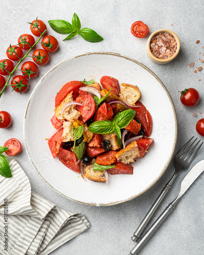Tuscan salad Panzanella with tomatoes and bread, Italian cuisine dish, view from above