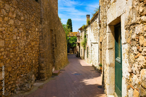 View of one of the streets of the historic center of Sant Martí d'Empúries, Costa Brava, Catalonia, Spain photo