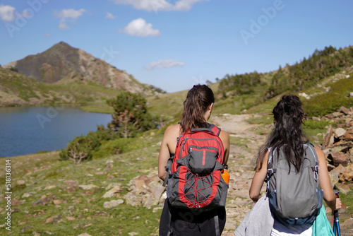 Two girls walking through the mountains in the Pyrenees