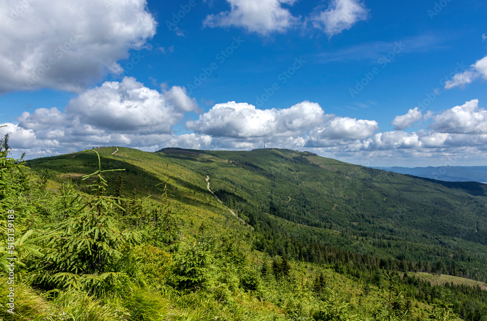 Mountain landscape against blue sky and white clouds Mountain landscape against blue sky and white clouds