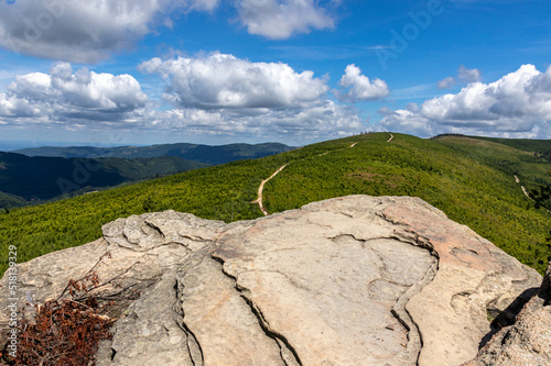 Fototapeta Naklejka Na Ścianę i Meble -  Malinowska rock on the background of mountain landscape and sky and clouds