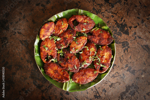Kerala Style Fish Fry seafood seer fish fried on banana leafe