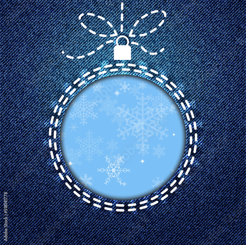 Fototapeta Indigo blue denim background with cutout Christmas bauble decorated with snowflakes