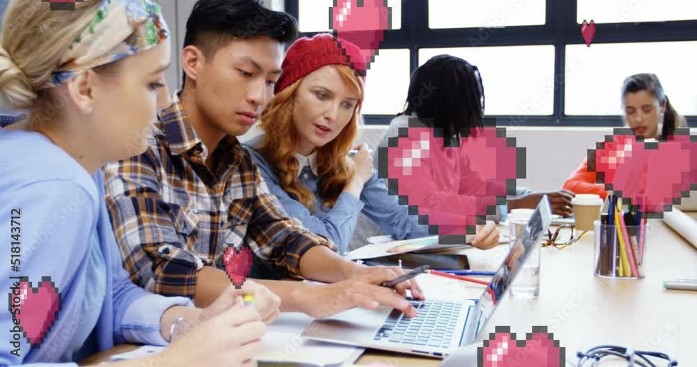 Animation of hearts falling over diverse businesspeople working in office Animation of hearts falling over diverse businesspeople working in office