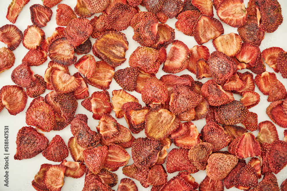Fresh many strawberry dried fruit on the white background, in the wooden cup. Fresh many strawberry dried fruit on the white background, in the wooden cup.