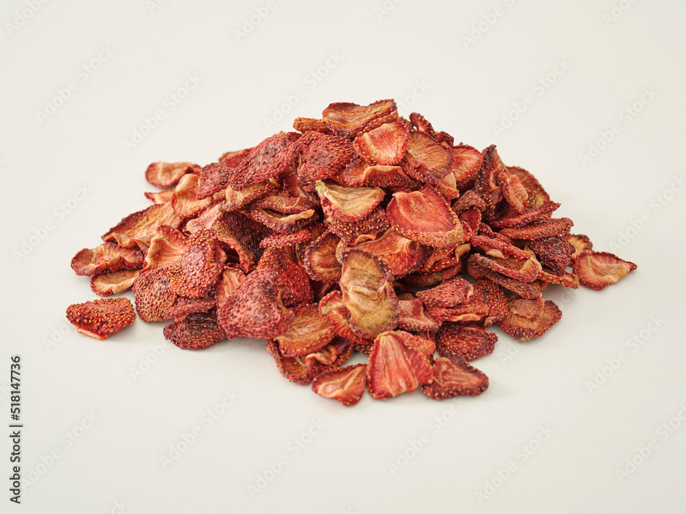 Fresh many strawberry dried fruit on the white background, in the wooden cup. Fresh many strawberry dried fruit on the white background, in the wooden cup.