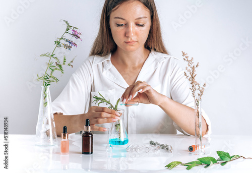 Woman working with cosmetic, scientist,doctor, make alternative herb medicine with herbal the organic natural in the laboratory. oil capsule, natural organic skincare and cosmetic.
