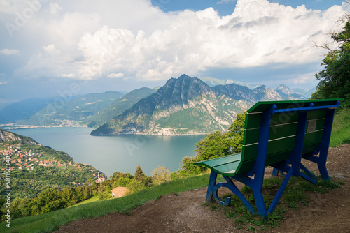 View from "Big Bench" to Lake Iseo and Mount Corna Trentapassi at sunny day with clouds. Fonteno, Bergamo, Lombardy, Italy.