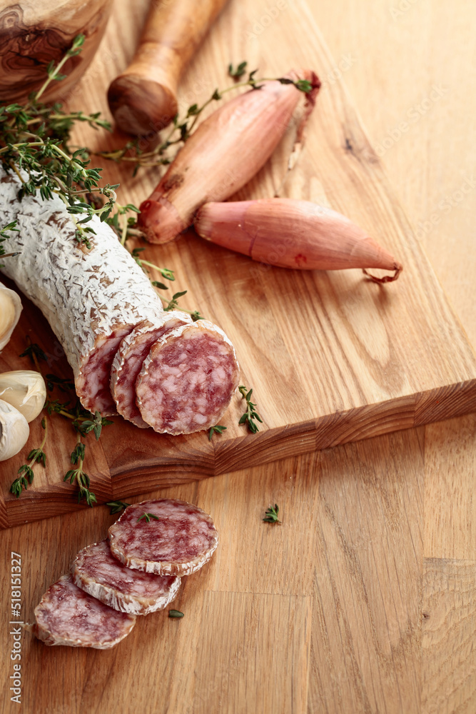 Dry-cured sausage with thyme, garlic, and onion. Dry-cured sausage with thyme, garlic, and onion.