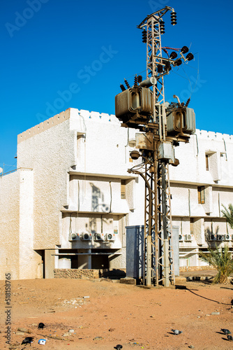 Electric transformer in the blue sky in the slums of Egypt