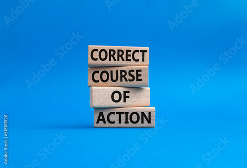 Correct course of action symbol. Concept words Correct course of action on wooden blocks. Beautiful blue background. Business and Correct course of action concept. Copy space. photo