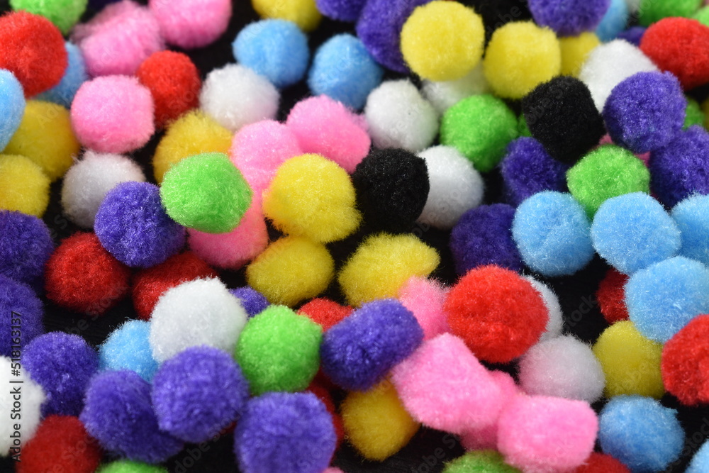 multicolored balls of wool on a black background multicolored balls of wool on a black background