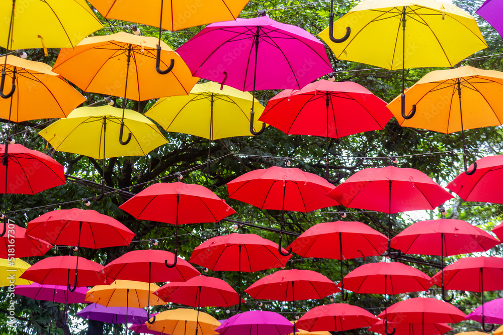 Street decorated with colorful umbrella. Runner of colorful umbrellas.