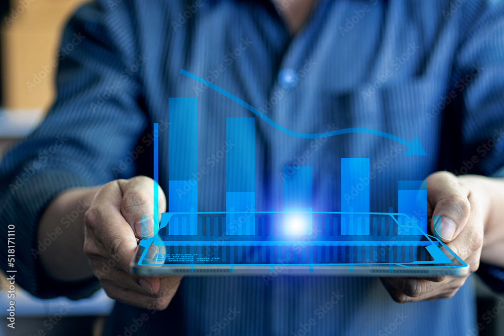Businessman holding a falling graph with a collapsed financial graph. financial concept Businessman holding a falling graph with a collapsed financial graph. financial concept