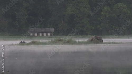 Peaceful Morning at Situ Patengan Patenggang Lake in Ciwidey Bandung West Java Indonesia - Steam Fog Above The Water photo