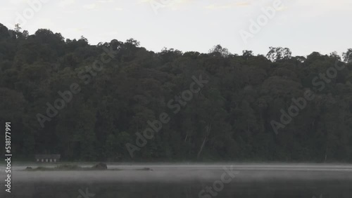 Peaceful Morning at Situ Patengan Patenggang Lake in Ciwidey Bandung West Java Indonesia - Steam Fog Above The Water photo
