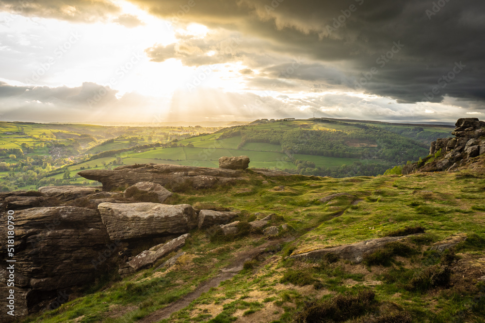 Golden sunset over fields after a heavy storm in the Peak District