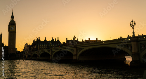 People walking across Westminster Bridge, Big Ben at Sunset in London, England