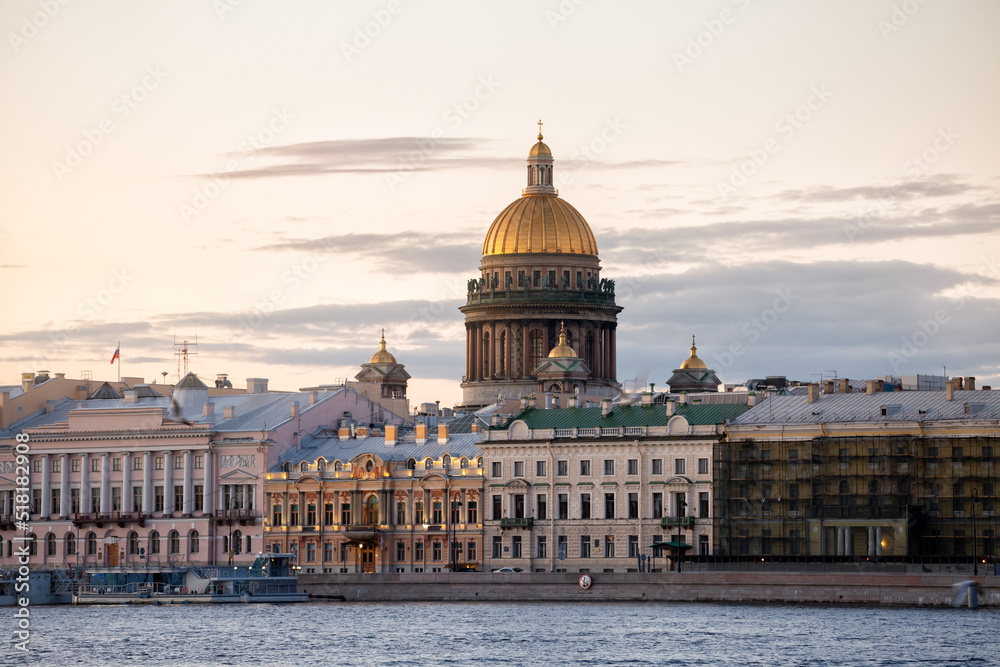 English Embankment and St. Isaac's Cathedral at dawn on a white night in St. Petersburg, Russia