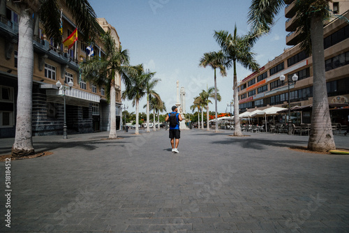 photographer walking through streets of Santa Cruz de Tenerife