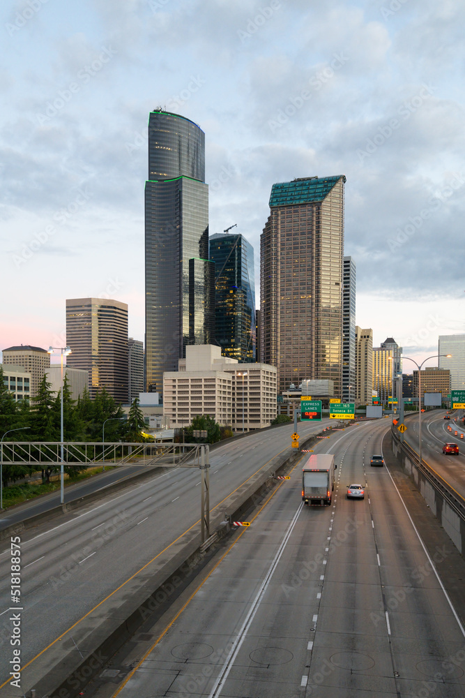 Seattle - July 09, 2022; City of Seattle skyline at dawn with Interstate 5 and a few vehicles in the early morning