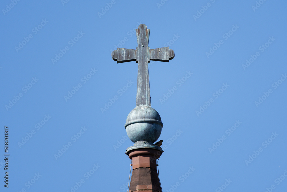 cross on the spire of a protestant church in cologne