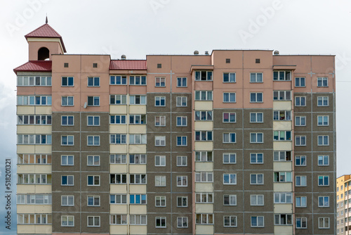 Beautiful modern multi-storey building in a new area of the city. View of the windows of an apartment panel house. An ordinary apartment building in a Russian city.