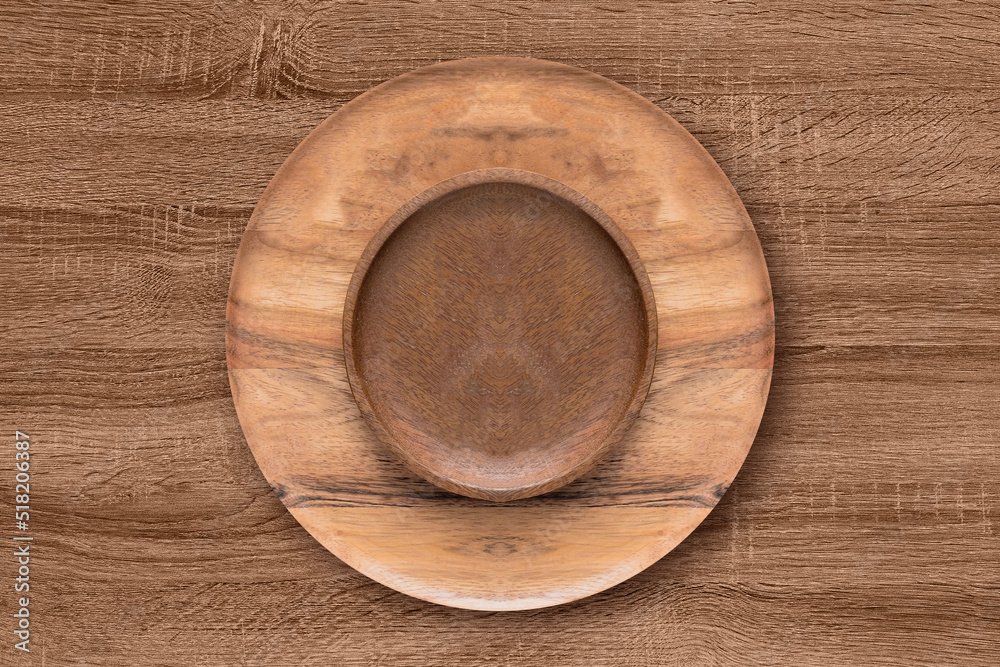 Bowl and wooden plate on the wooden table. Wooden concept Bowl and wooden plate on the wooden table. Wooden concept