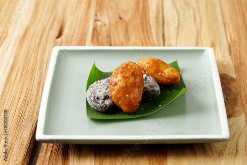 Gemblong and Getas, Traditional Sweet Indonesian Cake made from Sticky Rice flour, Deep Fried, and Coating with Sugar.. photo