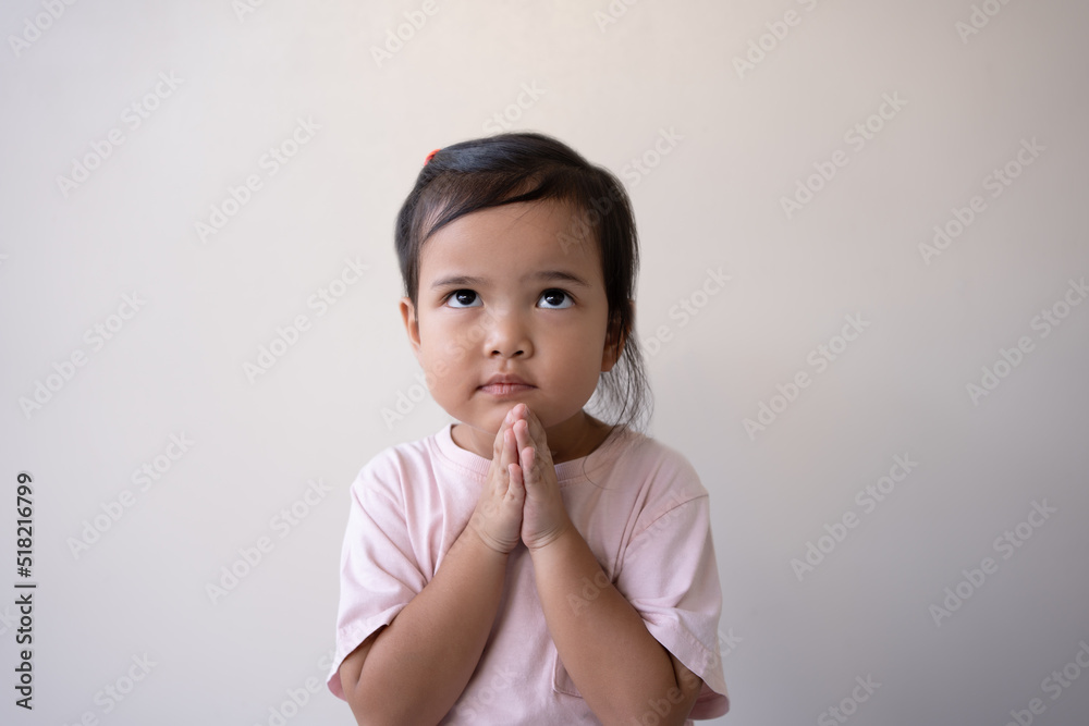 Asian little girl praying hopeful eyes, hope and peace concept. Asia kid in hopeful reaction. Asian little girl praying hopeful eyes, hope and peace concept. Asia kid in hopeful reaction.