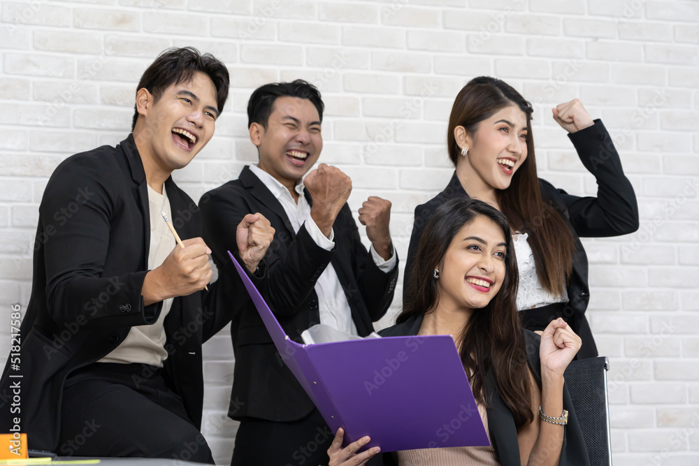Yes! Businesspeople triumphing because of the financial growth of company. Happy smiling businesspeople triumphing with raised fists. Yes! Businesspeople triumphing because of the financial growth of company. Happy smiling businesspeople triumphing with raised fists.