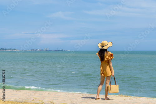 Tourist woman stand on the beach © leungchopan
