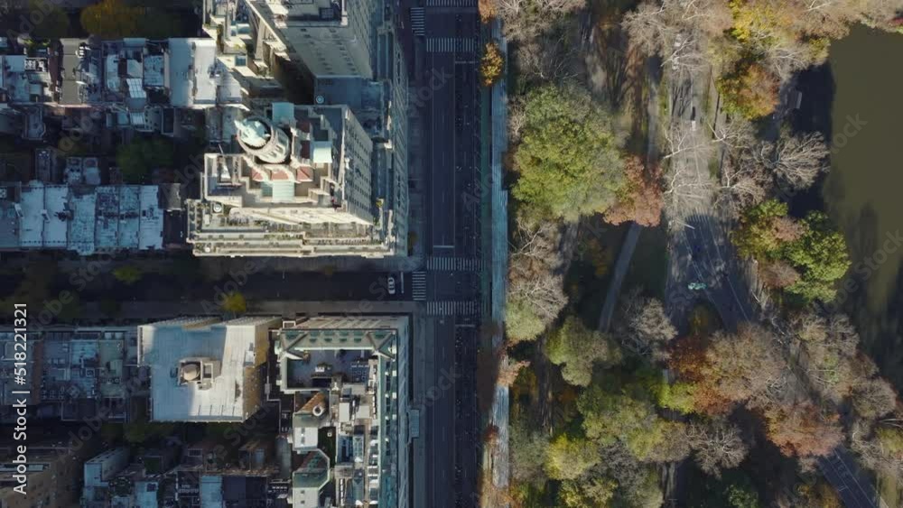 Aerial birds eye overhead top down view of buildings and street along Central park. Two towers of historical San Remo building. Manhattan, New York City, USA