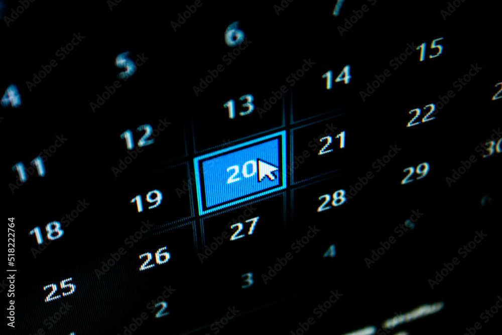 Pixel calendar and mouse cursor on computer monitor. Calendar with days ...