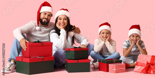 Happy family in Santa hats ...