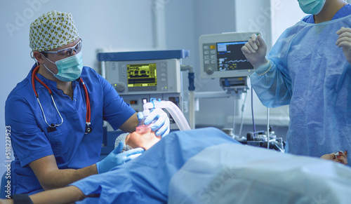 Man surgeon at work in operating room
