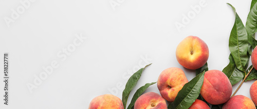 Many ripe peaches on white background with space for text photo