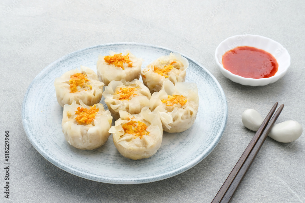 Steamed dumpling dimsum served in plate, close up. Steamed dumpling dimsum served in plate, close up.
