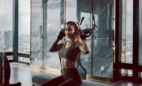 Happiness Sport Fitness woman exercise with listen music for wireless internet headphone perfect body relaxing after gym training.