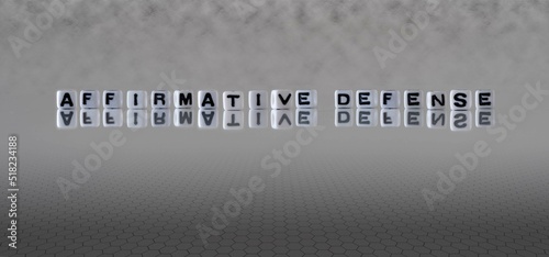 affirmative defense word or concept represented by black and white letter cubes on a grey horizon background stretching to infinity