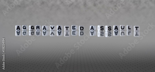 фотографія aggravated assault word or concept represented by black and white letter cubes o