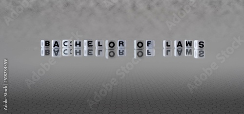 Foto bachelor of laws word or concept represented by black and white letter cubes on