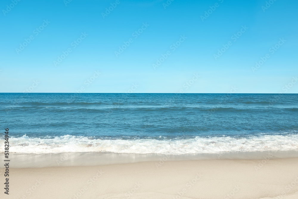 Picturesque view of beautiful sea and sandy beach on sunny day - obrazy, fototapety, plakaty 